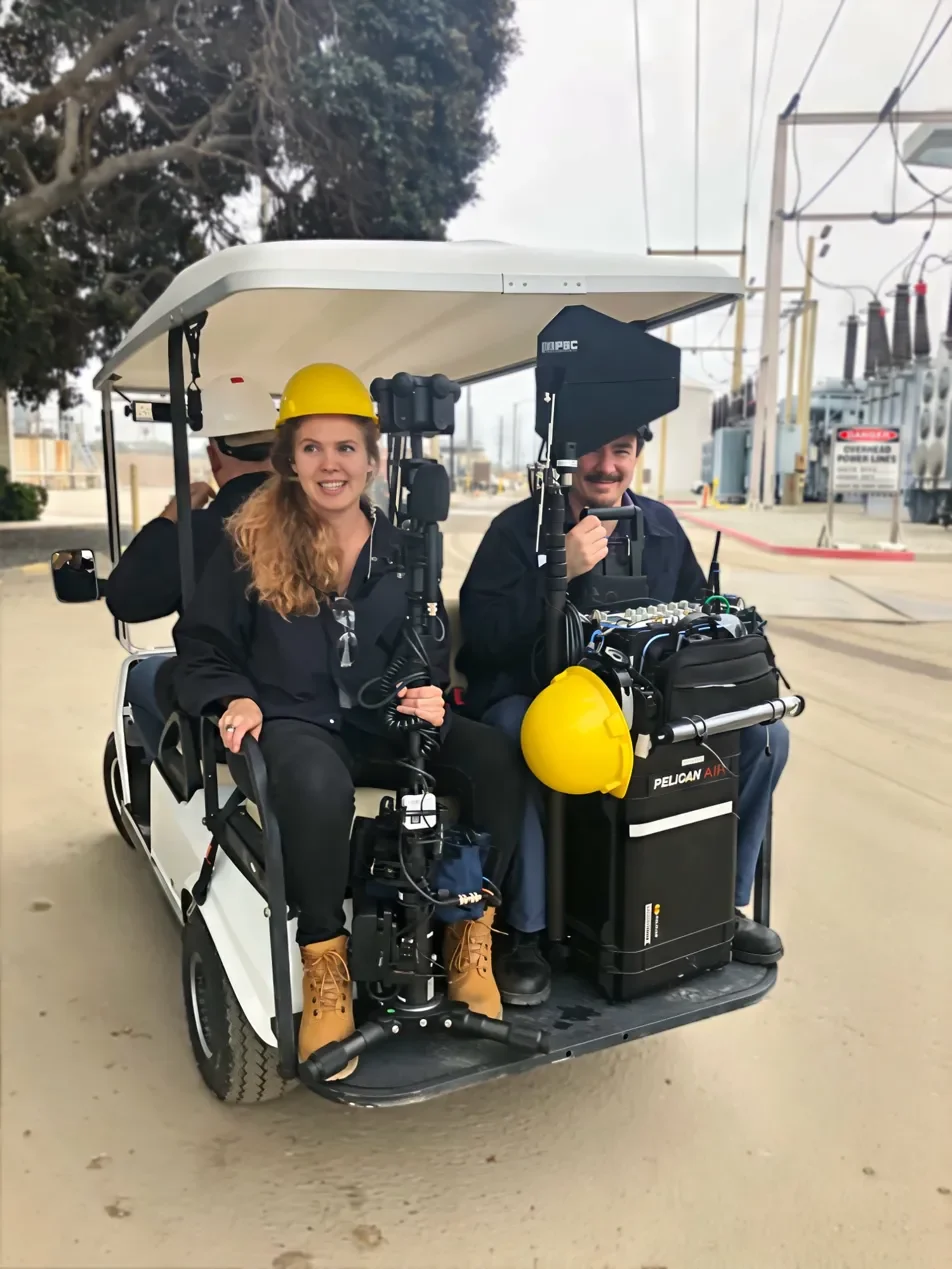 Hanna Rodgers on location — VR camera rig, hard hat, utility substation