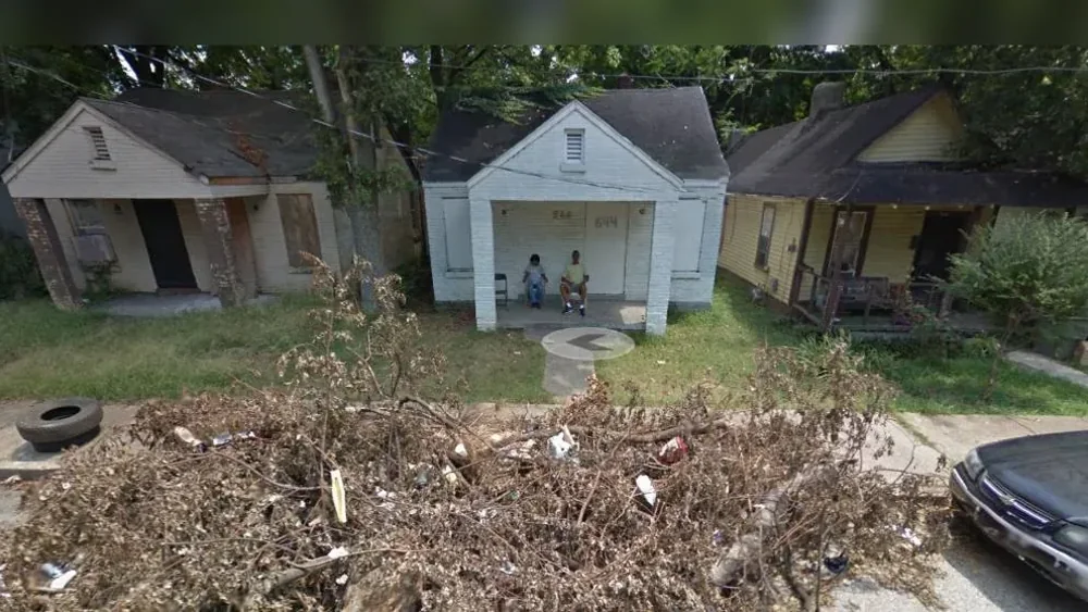 Portraits of Earth — a Google Street View frame of two people on a porch in Memphis