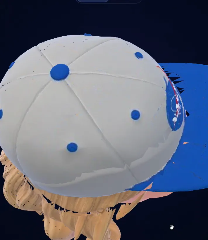 Torn seams along the edge of the cap